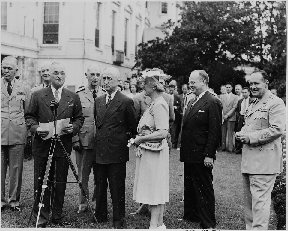 Photograph of President Truman reading the citation for Secretary Byrnes's Distinguished Service Medal, as General... - NARA - 199184