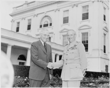 Photograph of President Truman shaking hands with Field Marshal Bernard Montgomery on the White House lawn. - NARA - 199428