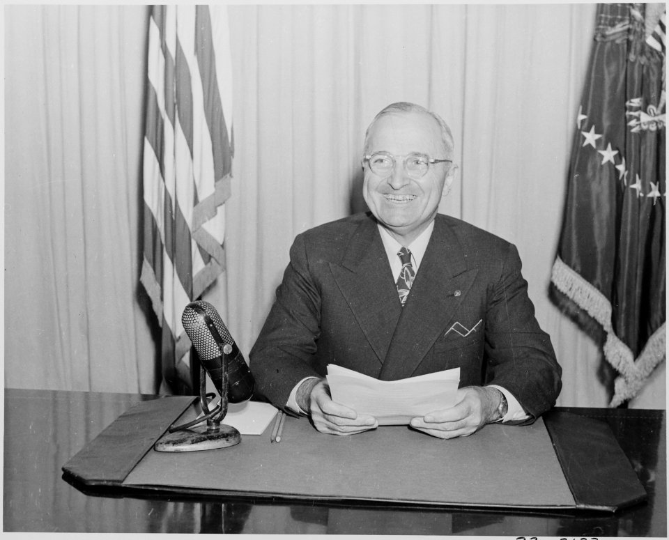 Photograph of President Truman smiling, on the occasion of his radio speech to the nation on the reconversion program. - NARA - 199292