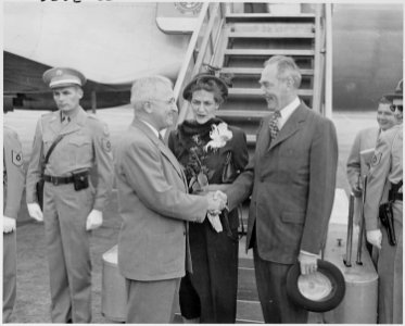 Photograph of President Truman shaking hands with Secretary of State Dean Acheson at the airport in Washington, as... - NARA - 200117