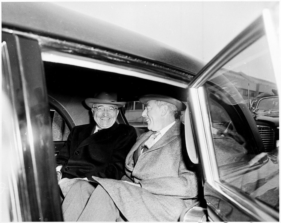 Photograph of President Truman sitting in his limousine with Secretary of State Dean Acheson at Washington National... - NARA - 200346