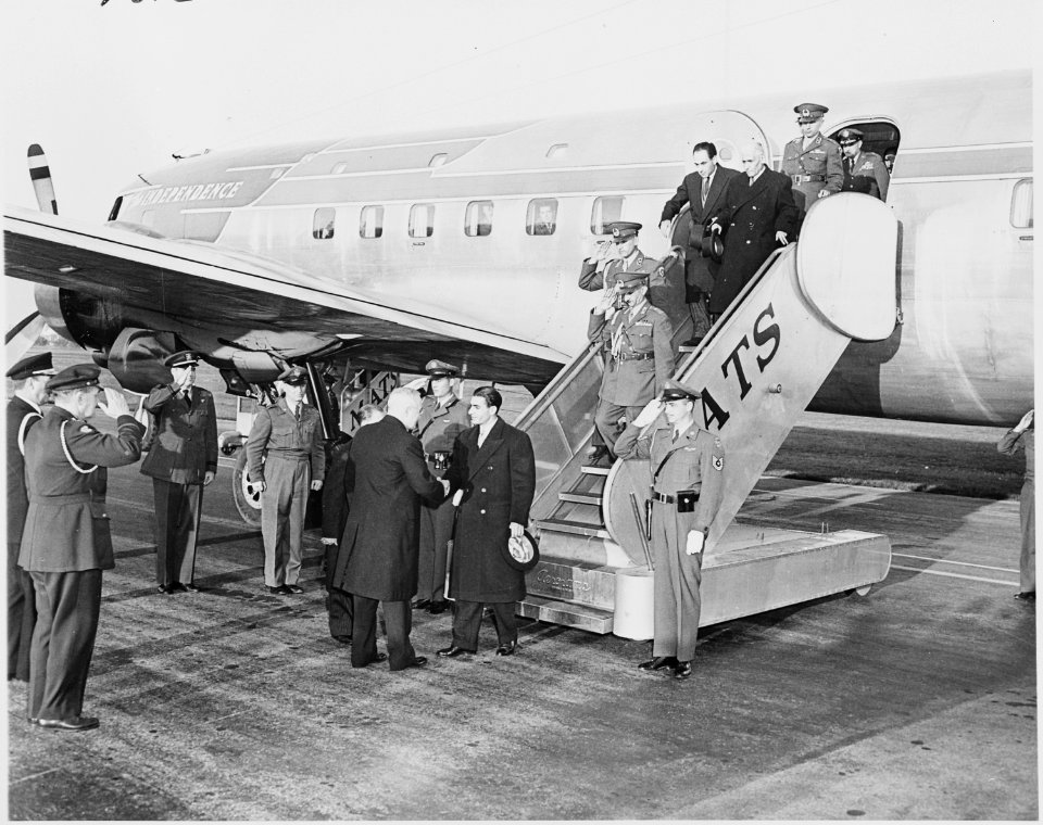 Photograph of President Truman shaking hands with the Shah of Iran upon the Shah's arrival at Washington National... - NARA - 200141
