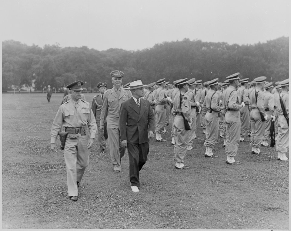 Photograph of President Truman walking past the military police of the District of the Columbia as they stand at... - NARA - 199383