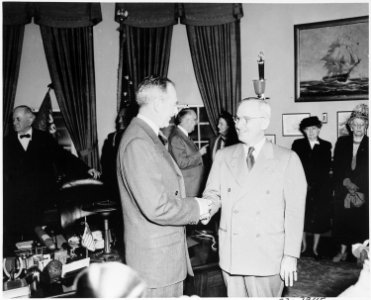 Photograph of President Truman shaking hands with Secretary of State Dean Acheson, at Acheson's swearing-in ceremony... - NARA - 200075