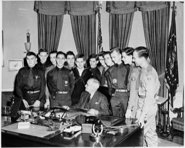 Photograph of President Truman with a group of twelve Boy Scouts who have achieved the status of Eagle Scout, in the... - NARA - 200184 photo