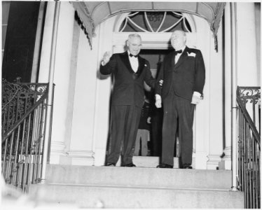 Photograph of President Truman and Winston Churchill outside Blair House in Washington, during Churchill's visit to... - NARA - 200110 photo