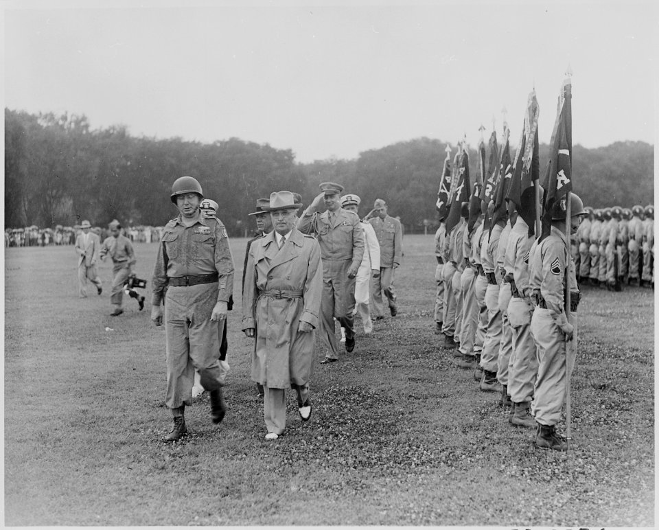 Photograph of President Truman walking past troops standing at attention during his review of the Japanese-American... - NARA - 199391