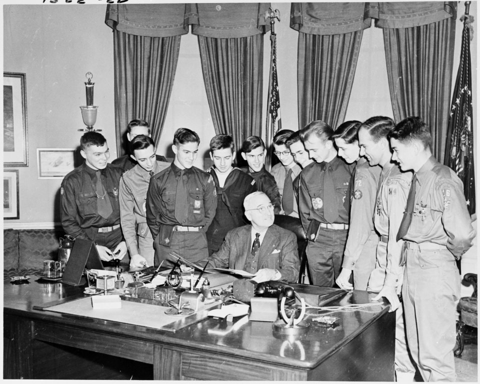 Photograph of President Truman with a group of twelve Eagle Scouts in the Oval Office of the White House. - NARA - 200183