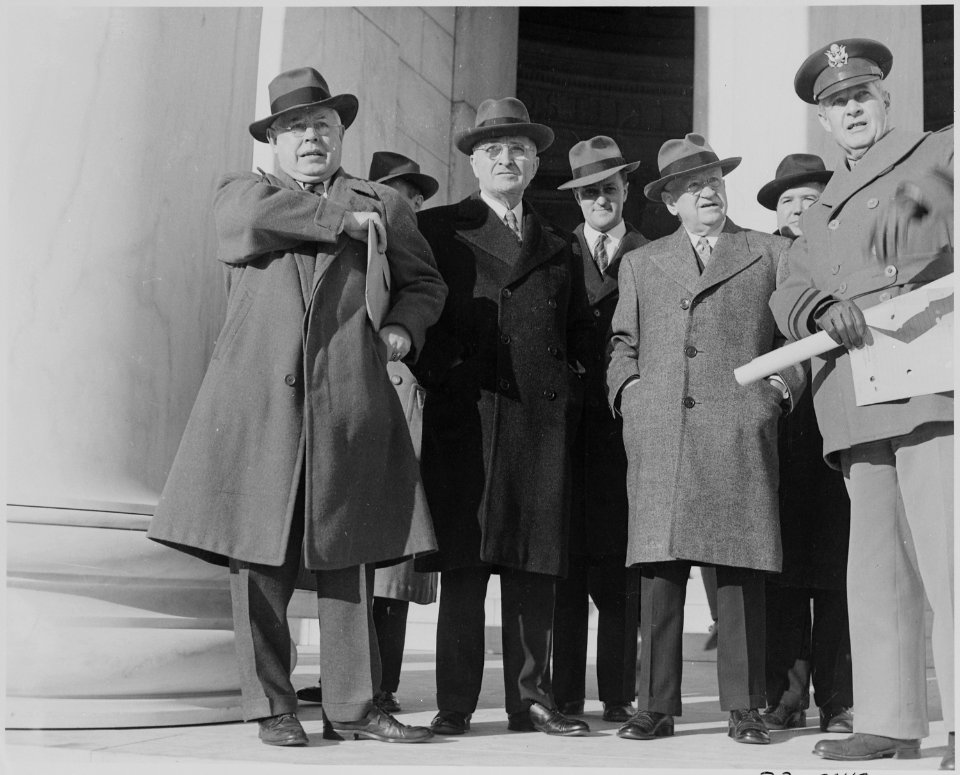 Photograph of President Truman with Secretary of the Interior Harold Ickes and others, probably standing outside the... - NARA - 199302