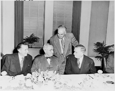 Photograph of President Truman with Secretary of the Interior Oscar Chapman (left) and other dignitaries, during a... - NARA - 200267