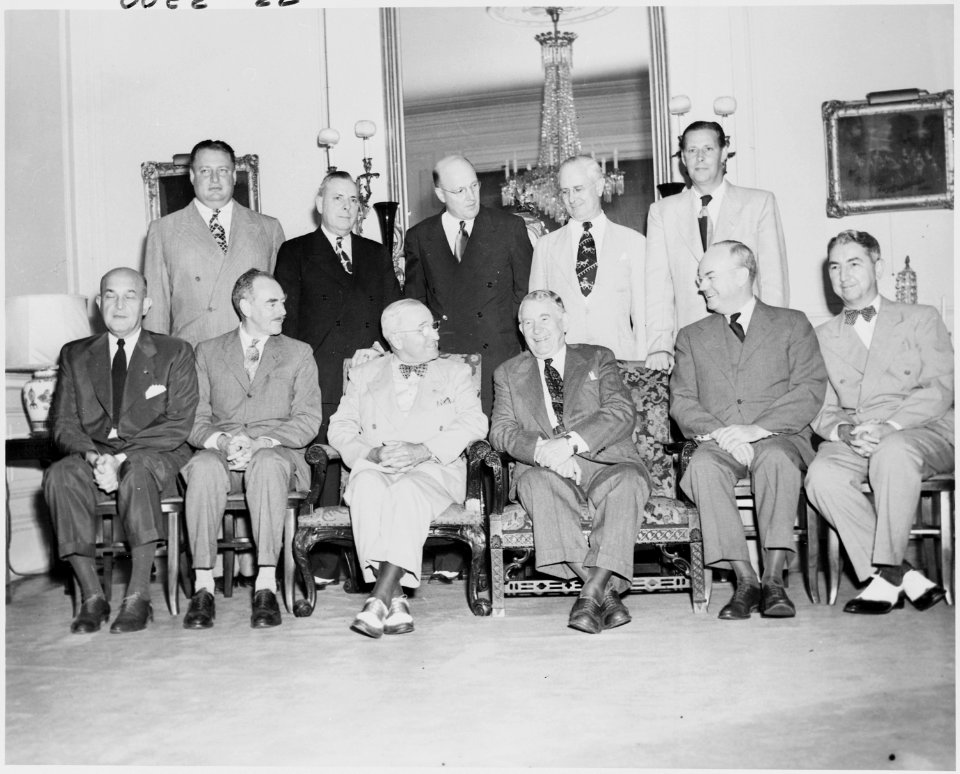 Photograph of President Truman with his Cabinet, at Blair House, (seated, left to right) Secretary of Defense Louis... - NARA - 200166