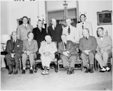 Photograph of President Truman with his Cabinet, at Blair House, (seated, left to right) Secretary of Defense Louis... - NARA - 200166 photo