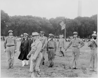 Photograph of President Truman with other dignitaries during his review of the Japanese-American 442nd Regimental... - NARA - 199395
