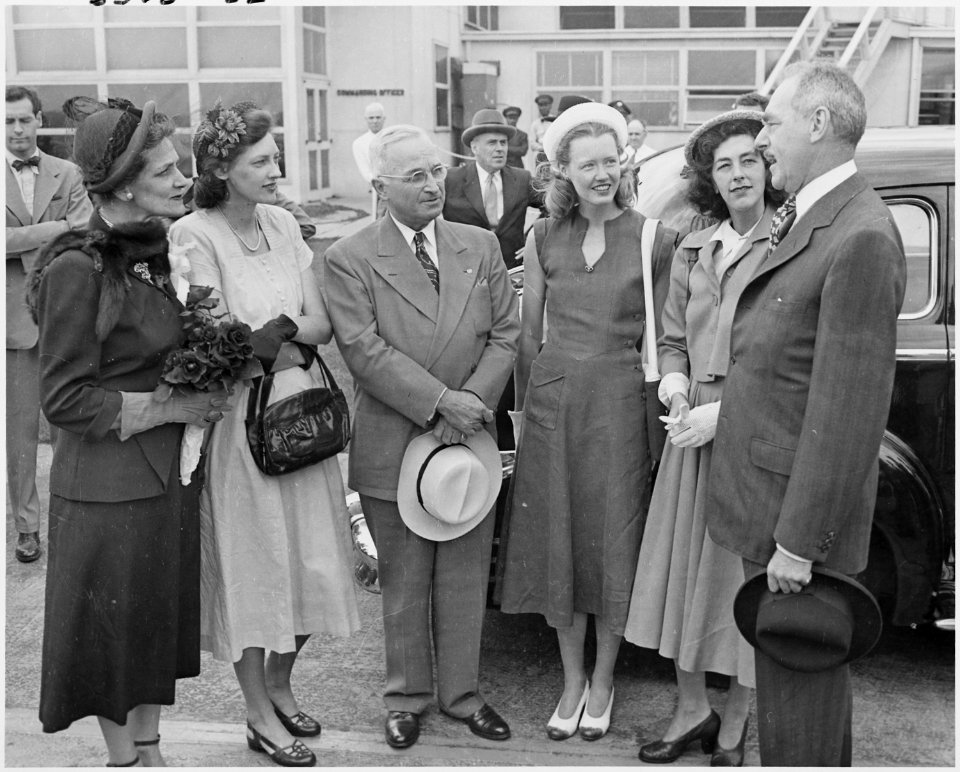Photograph of President Truman with Secretary of State Dean Acheson and members of his family, at the airport in... - NARA - 200116