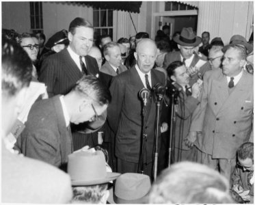Photograph of President-elect Dwight D. Eisenhower speaking with reporters at the White House, on the occasion of his... - NARA - 200396