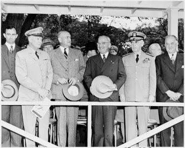 Photograph of President Truman with other dignitaries on the reviewing stand during a parade in honor of Armed Forces... - NARA - 200221