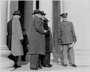Photograph of President Truman, Secretary of the Interior Harold Ickes, and others, probably standing outside the... - NARA - 199301