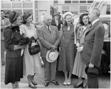 Photograph of President Truman with Secretary of State Dean Acheson and members of his family, at the airport in... - NARA - 200116 photo