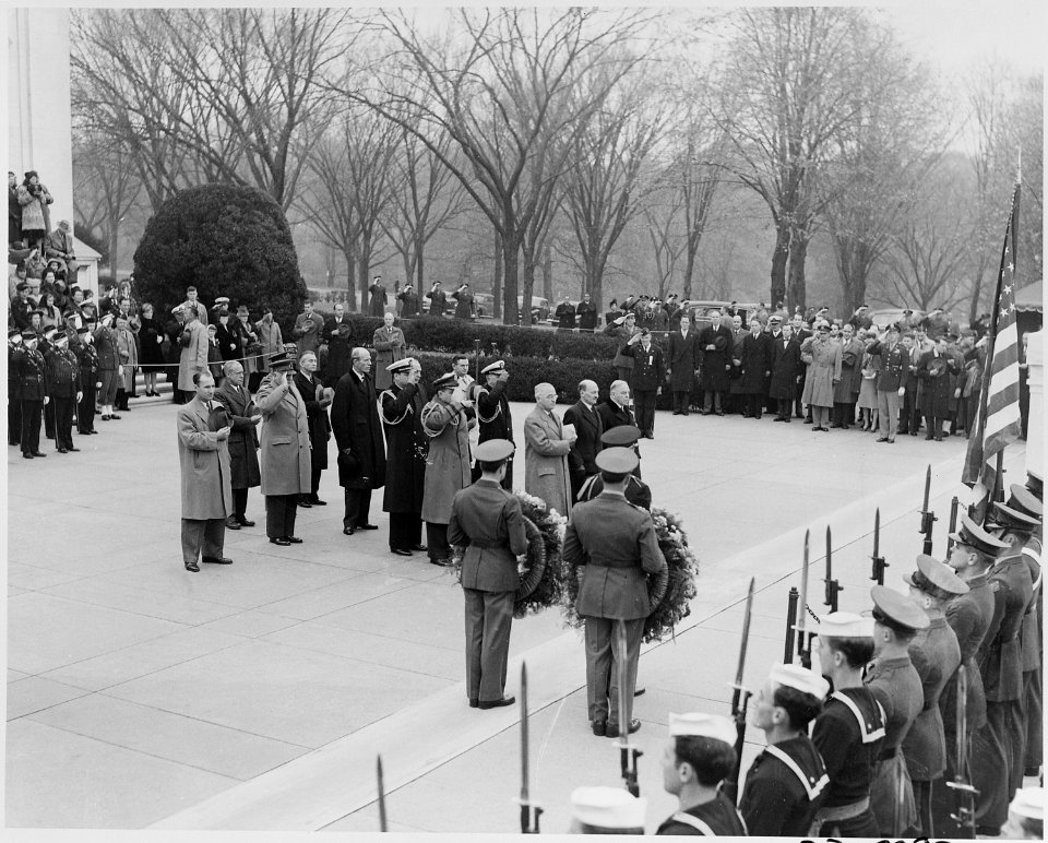 Photograph of President Truman, British Prime Minister Clement Attlee, and other dignitaries standing at attention... - NARA - 199252