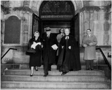 Photograph of President-elect Dwight D. Eisenhower and his wife Mamie leaving church in Washington on the morning of... - NARA - 200421 photo