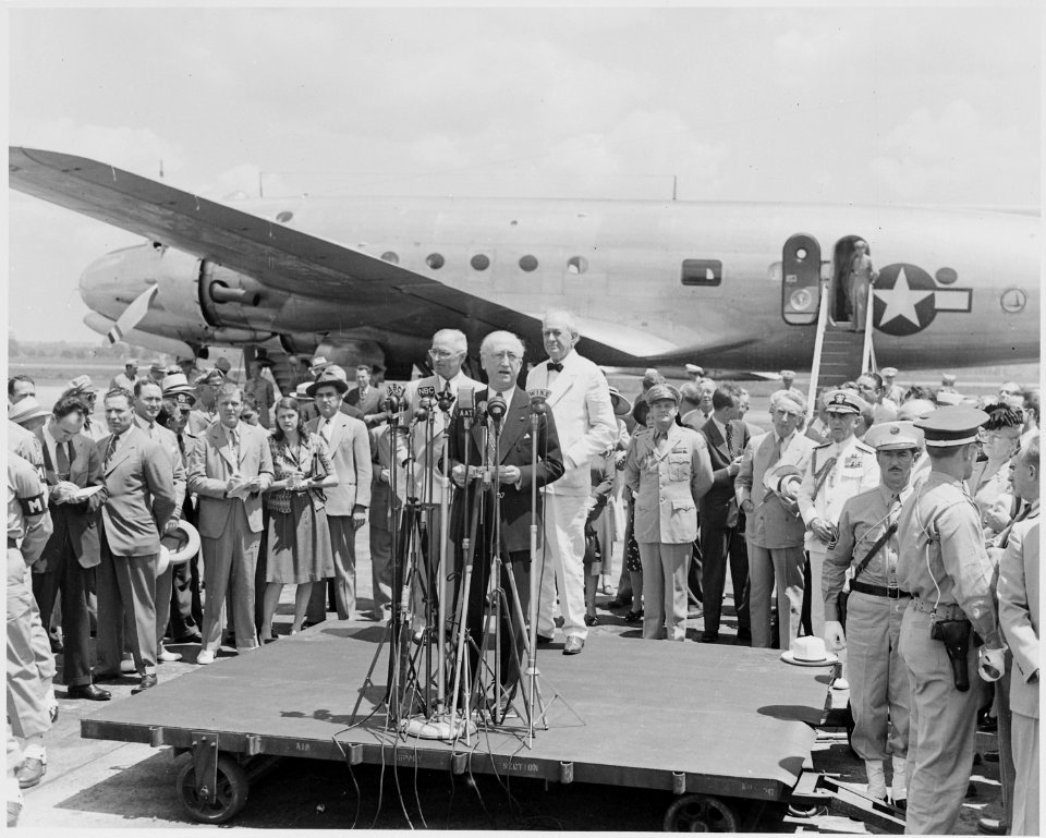 Photograph of Secretary of State James Byrnes making a statement as he prepares to board an airplane and depart for... - NARA - 199408