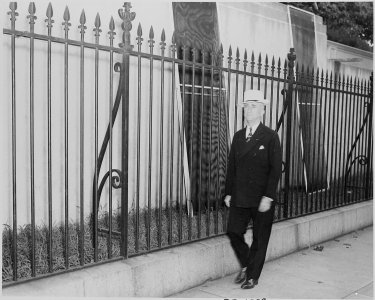 Photograph of Secretary of State James Byrnes, evidently leaving the White House after a Cabient meeting. - NARA - 199152