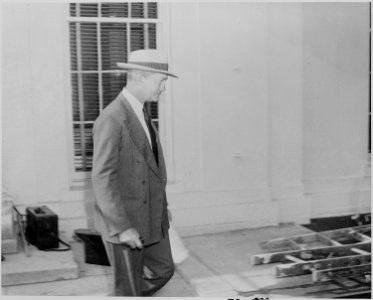 Photograph of Secretary of the Navy James Forrestal, evidently leaving the White House after a Cabinet meeting. - NARA - 199151