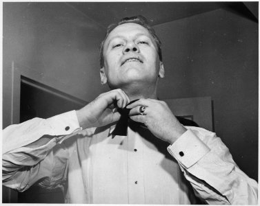 Photograph of Representative Gerald R. Ford Tying a Bow Tie - NARA - 186886