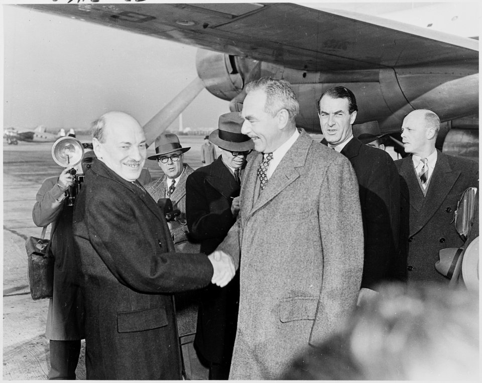 Photograph of Secretary of State Dean Acheson shaking hands with British Prime Minister Clement Attlee, upon Attlee's... - NARA - 200254
