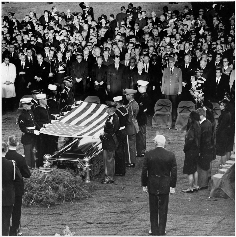 Photograph of servicemen removing the flag from the casket of President John F. Kennedy at Arlington National... - NARA - 200452