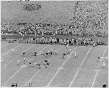 Photograph of some of the action on the field during the Army-Navy football game in Philadelphia, attended by the... - NARA - 200249