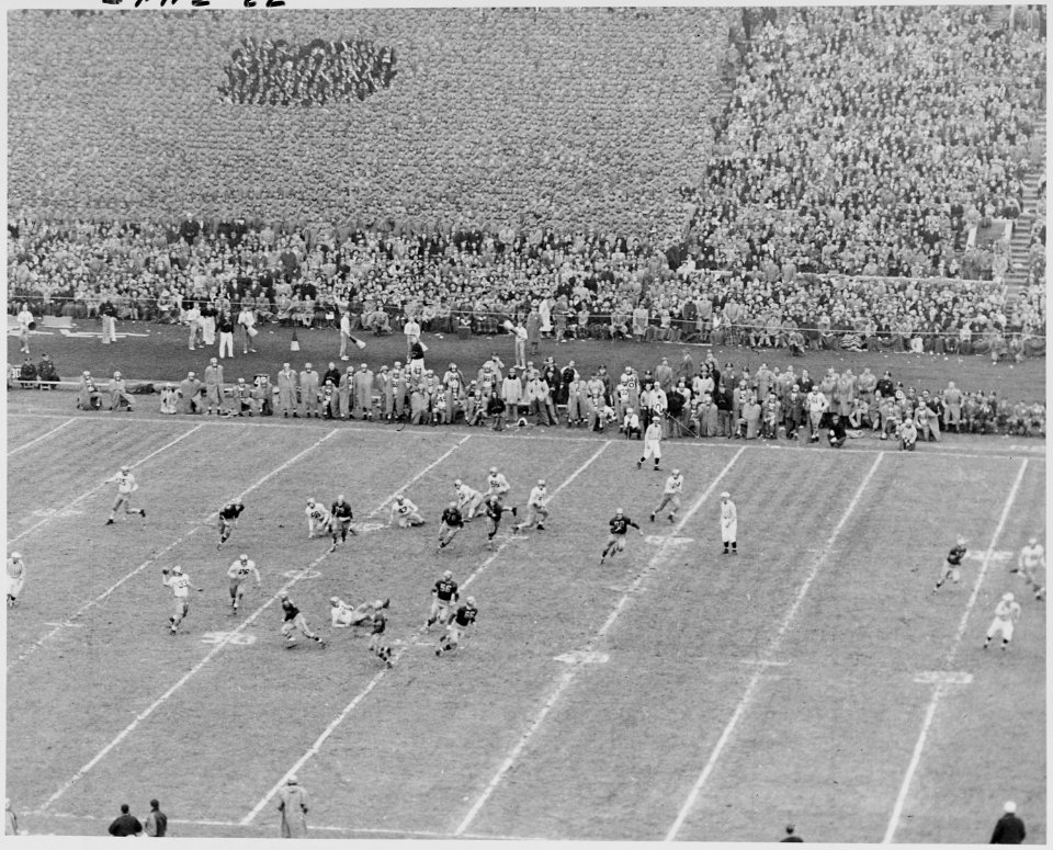 Photograph of some of the action on the field during the Army-Navy football game in Philadelphia, attended by the... - NARA - 200249