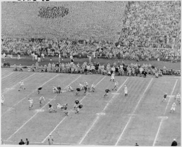 Photograph of some of the action on the field during the Army-Navy football game in Philadelphia, attended by the... - NARA - 200249