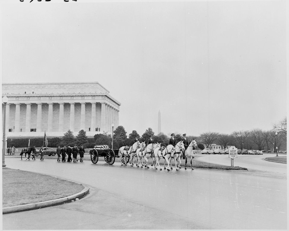 Photograph of the cortege accompanying the flag-draped casket of General Henry H. Hap Arnold, during the funeral... - NARA - 200187