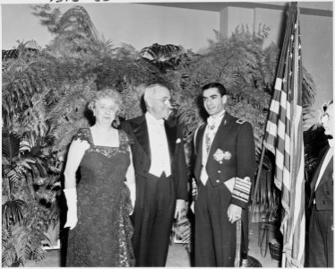 Photograph of the President and Mrs. Truman with the Shah of Iran, in formal attire, during the Shah's visit to the... - NARA - 200150 photo