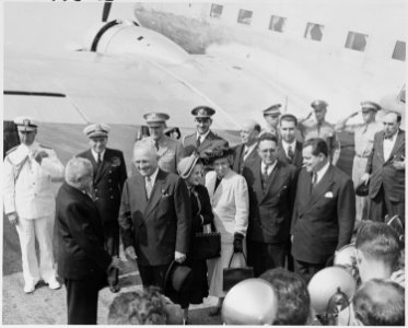 Photograph of the President and Mrs. Truman greeting President Eurico Dutra of Brazil at the airport in Washington... - NARA - 200120