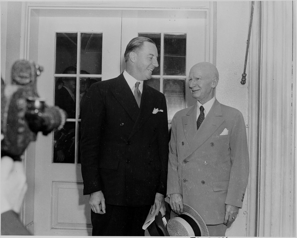 Photograph of two unidentified persons outside the White House on the occasion of the announcement of the Japanese... - NARA - 199157