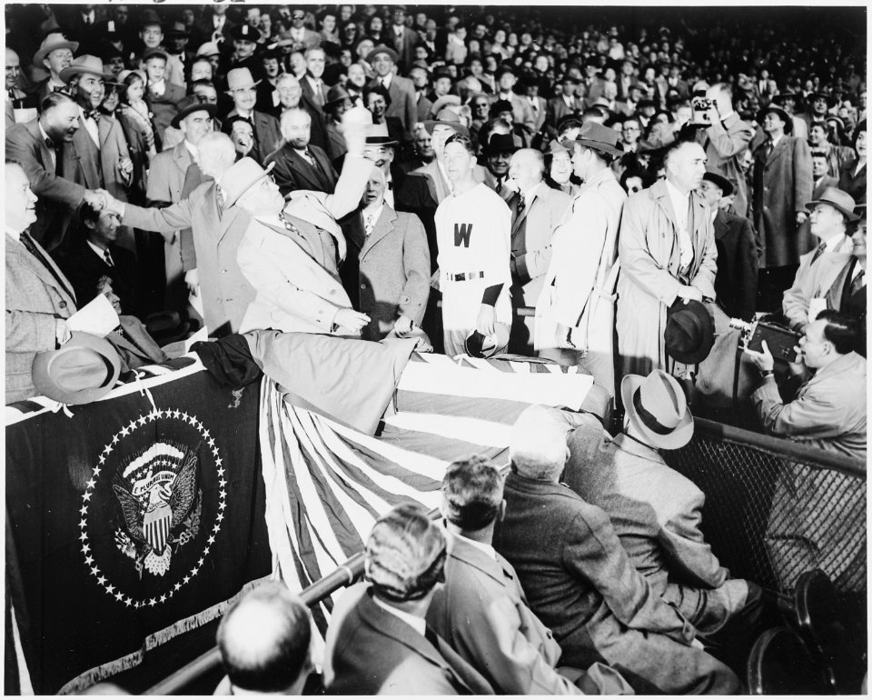 Photograph of President Truman throwing out the first ball from the presidential box at Washington's Griffith... - NARA - 200101