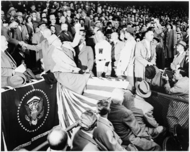 Photograph of President Truman throwing out the first ball from the presidential box at Washington's Griffith... - NARA - 200101