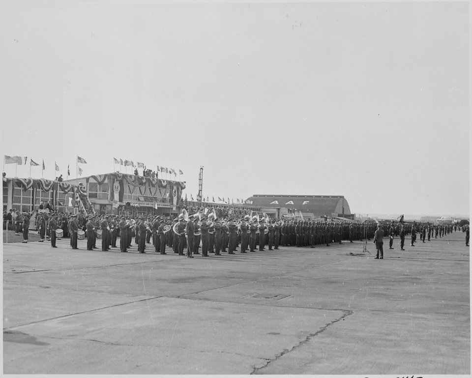 Photograph of troops at attention and military band playing at Washington's National Airport during welcoming... - NARA - 199567