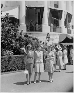 Photograph of three women on the South Grounds of the White House, presumably members of Fred Vinson's family, on the... - NARA - 199376 photo