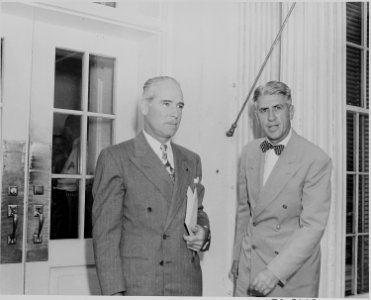 Photograph of two unidentified persons outside the White House on the occasion of the announcement of the Japanese... - NARA - 199156