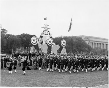 Photograph of troops marching at ceremonies honoring Admiral Chester Nimitz. - NARA - 199219 photo