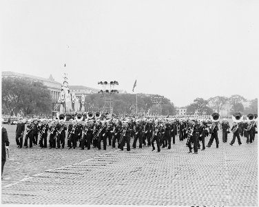 Photograph of U.S. Navy band marching at ceremonies honoring Admiral Chester Nimitz. - NARA - 199218