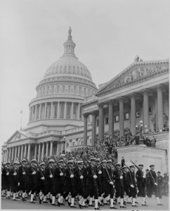 Photograph of troops marching past U.S. Capitol during ceremonies honoring Admiral Chester Nimitz. - NARA - 199203