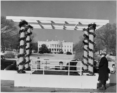 Photograph of workmen setting up the speaker's platform for the ceremonial lighting of the National Community... - NARA - 199276