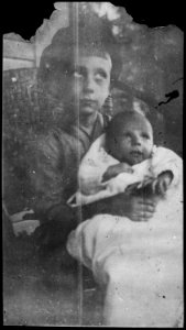 Photograph of Thomas Ford Holding Infant Richard Ford, Half-Brothers to Gerald R. Ford, Jr. - NARA - 186905 photo