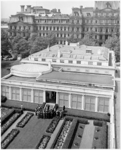 Photograph taken from overhead, showing President Truman speaking to a group of foreign journalists in the White... - NARA - 200319