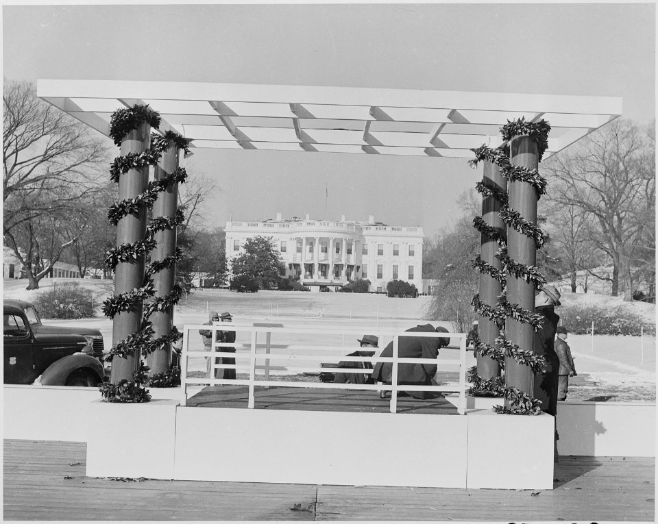 Photograph of workmen preparing the speaker's platform for the ceremonial lighting of the National Community... - NARA - 199277