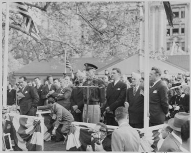 Photograph of unidentified dignitaries standing on a speaker's platform during welcoming ceremonies for Mexican... - NARA - 199559 photo